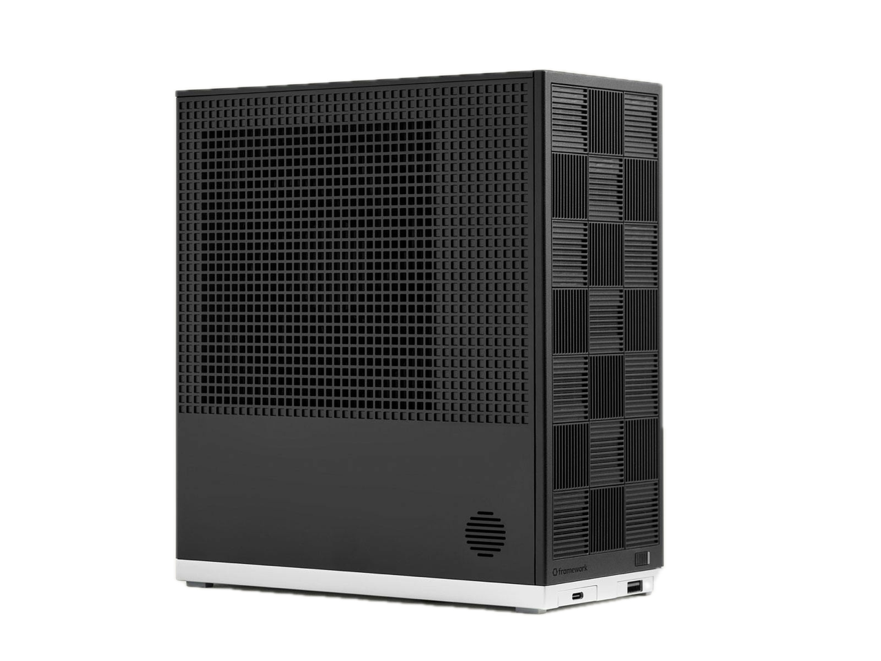 Framework Desktop — small-form-factor PC with a black grid front panel, three-quarter view